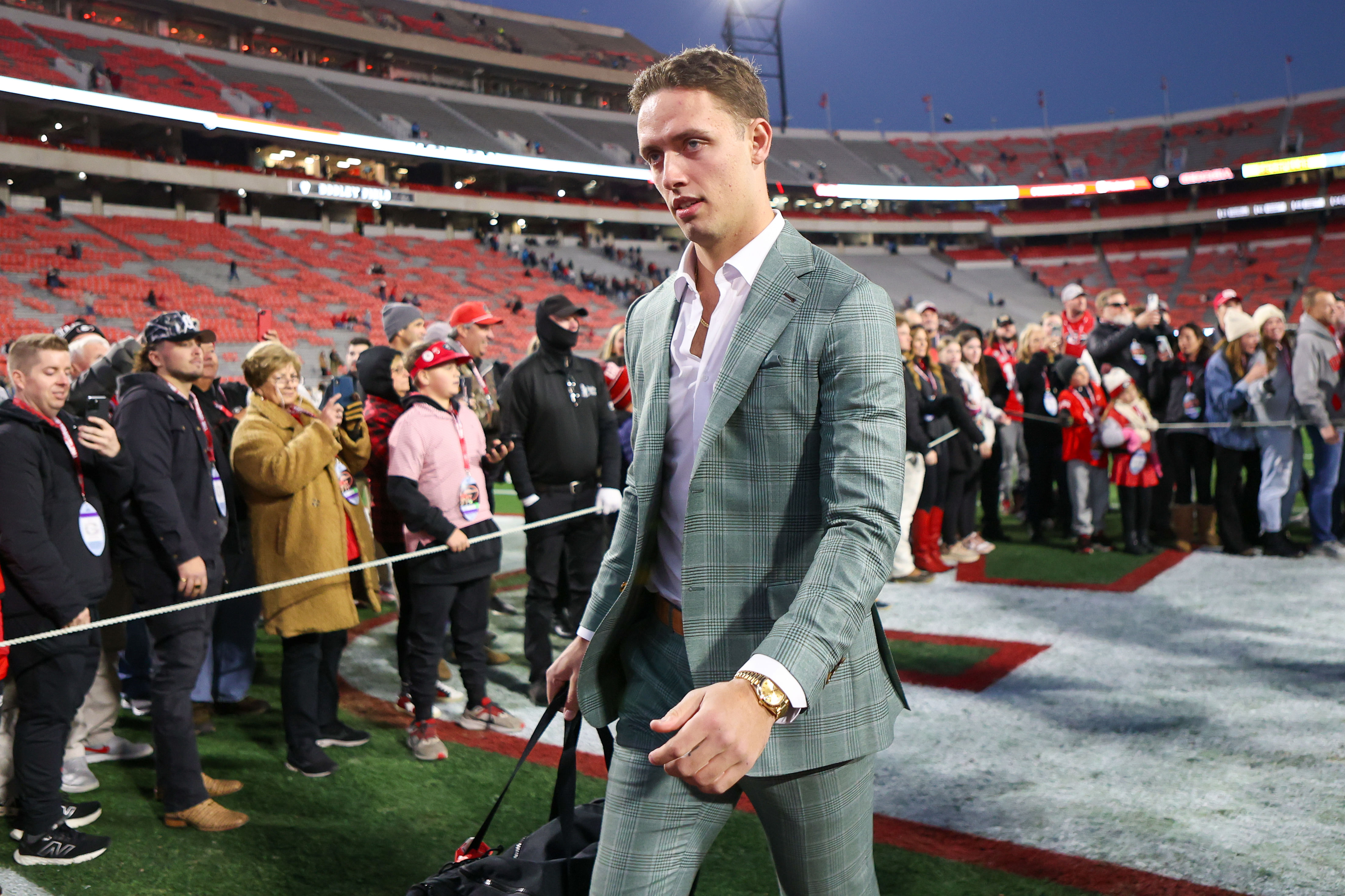 QB Beck (15) walks into Sanford Stadium - Source: Imagn